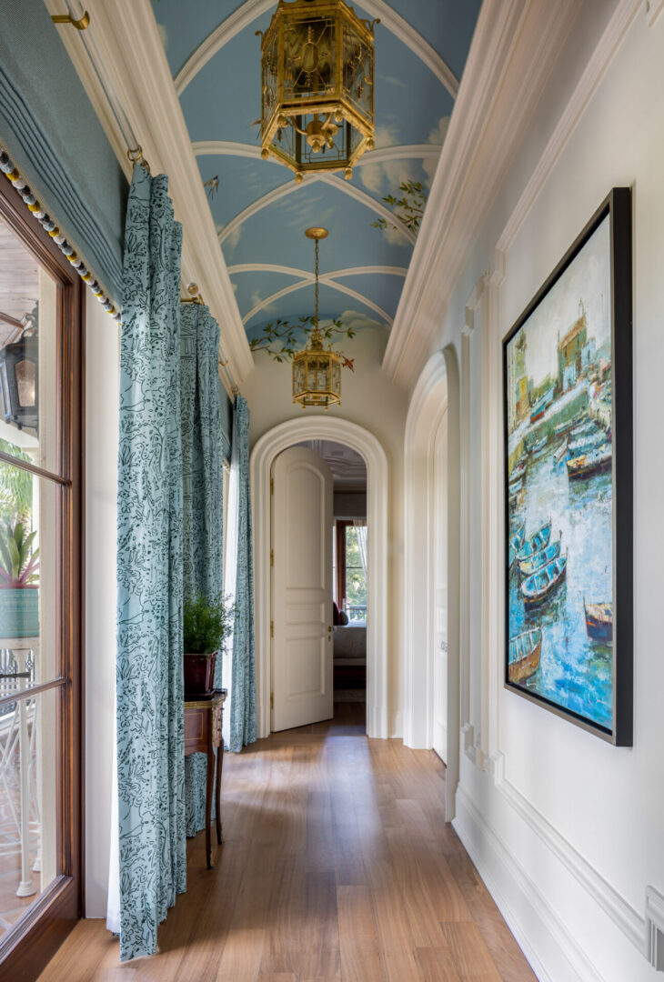 A hallway with blue walls and ceiling.